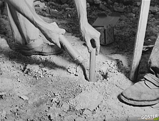 Inserting_dynamite_into_hole