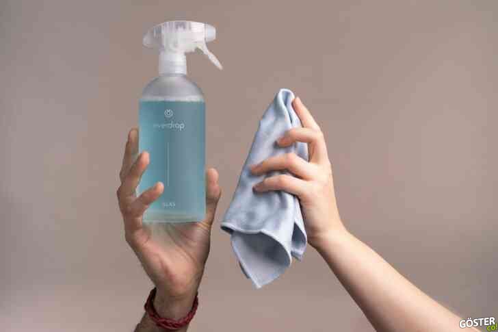 a person holding a bottle
